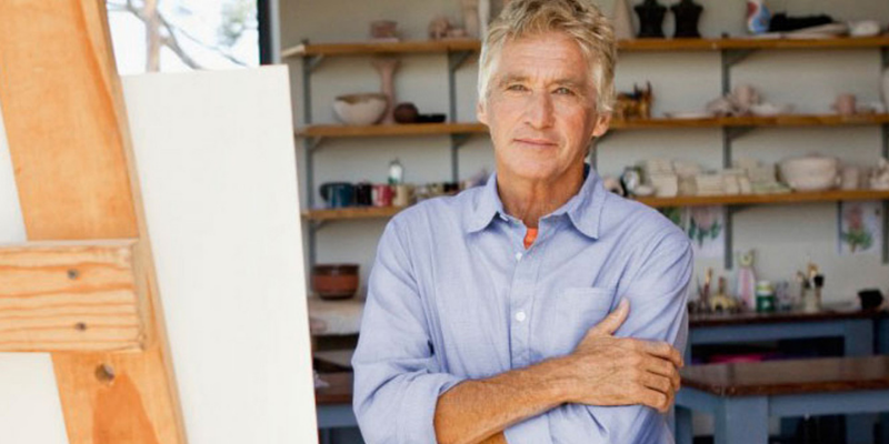 Man in retirement standing in his art studio