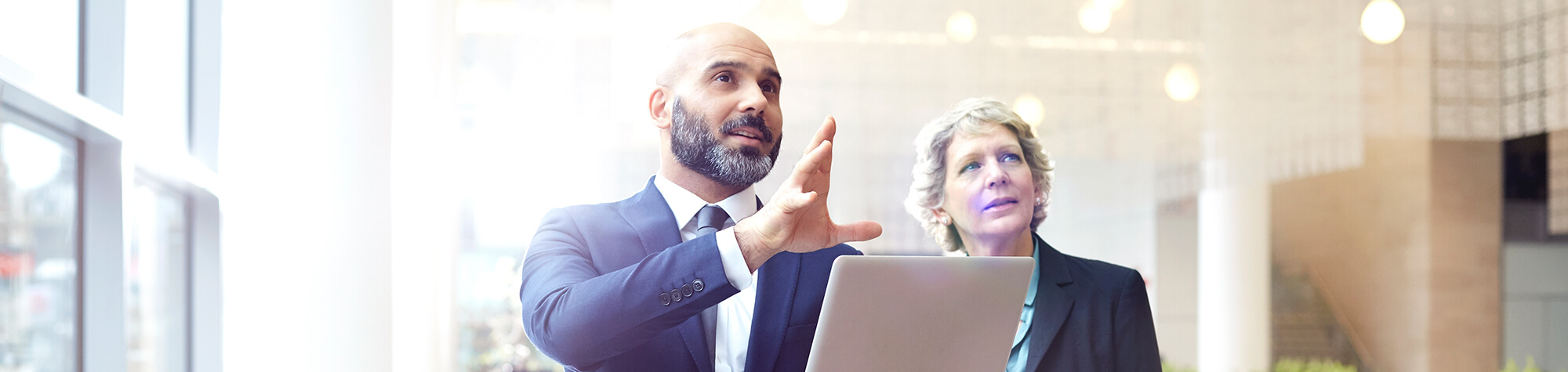 Businessman and business woman discussing the structure of their business