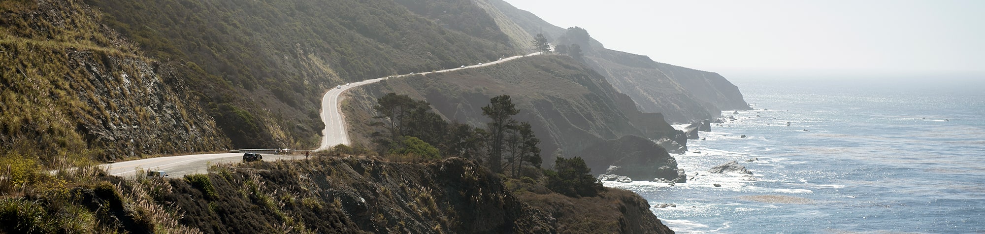 Highway on the coast of the water in the mountains