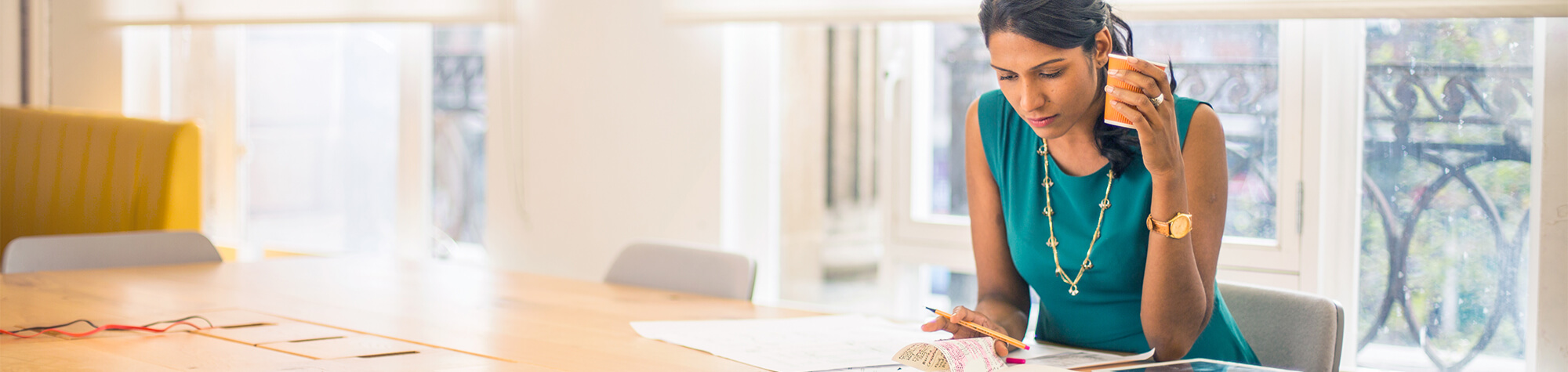 Women sitting at a desk working on her taxes