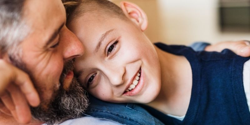 Child giving his dad a hug